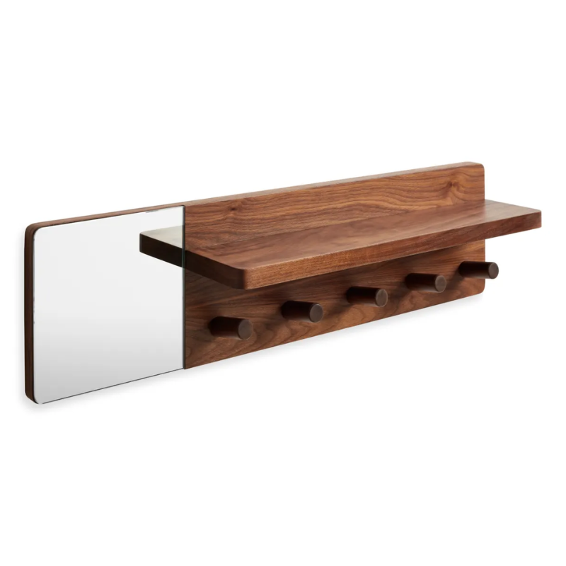 The Candid Wall Shelf with Hooks from Blu Dot in walnut from a high angle.