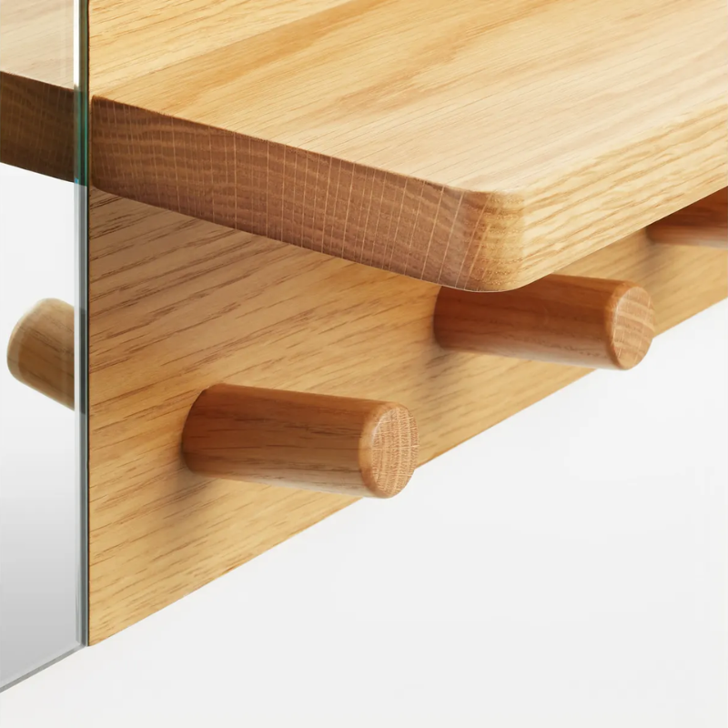 The Candid Wall Shelf with Hooks from Blu Dot in white oak close up.