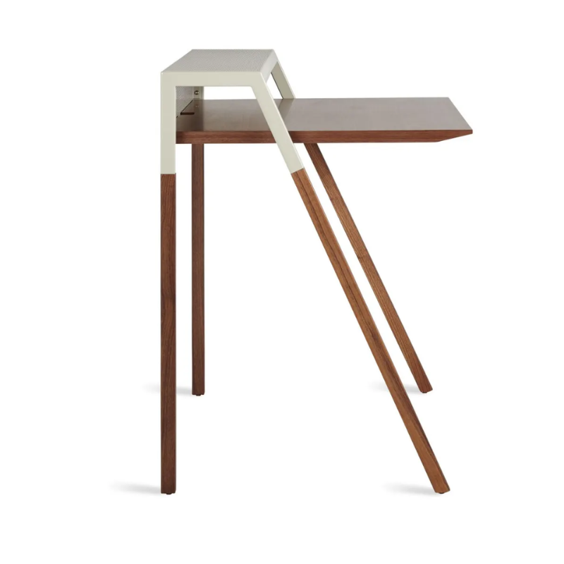 The Cant Desk from Blu Dot with walnut body and putty grey back from a high angle.