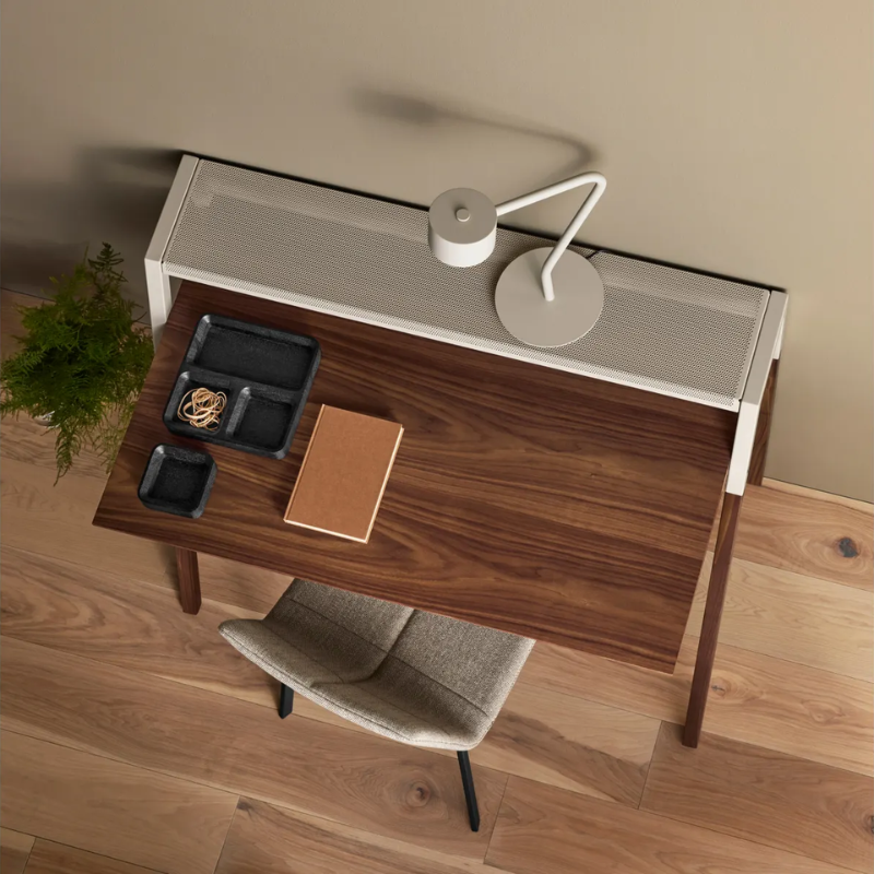 The Cant Desk from Blu Dot with walnut body and putty grey back in a home office.