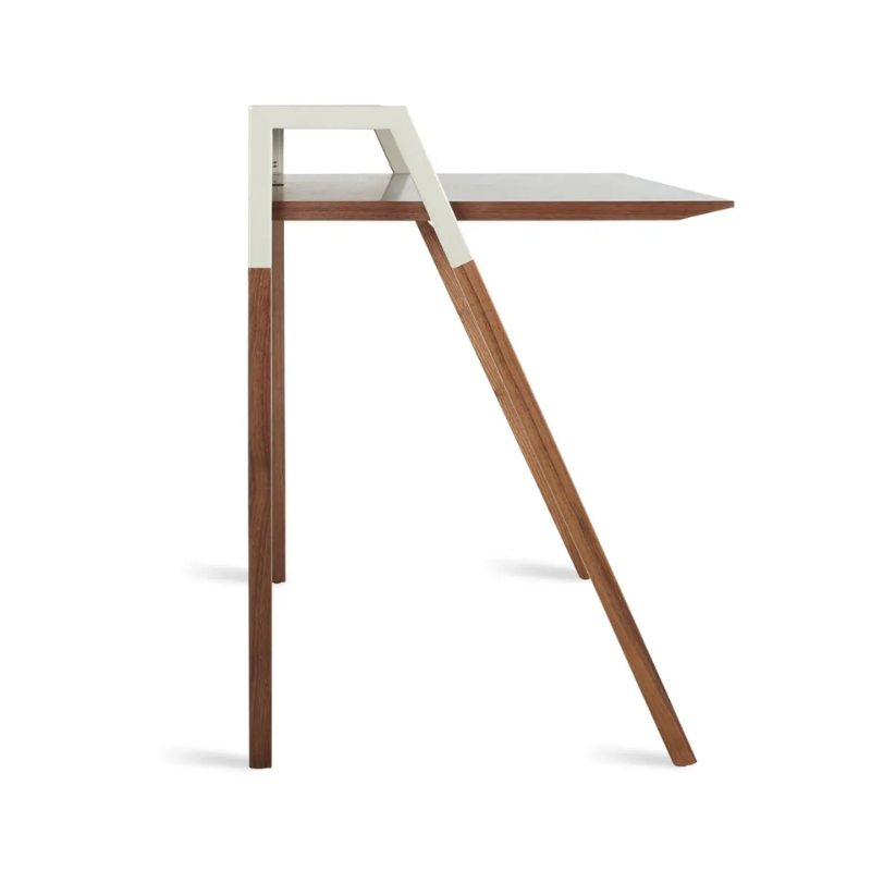 The Cant Desk from Blu Dot with walnut body and putty grey back from the side.