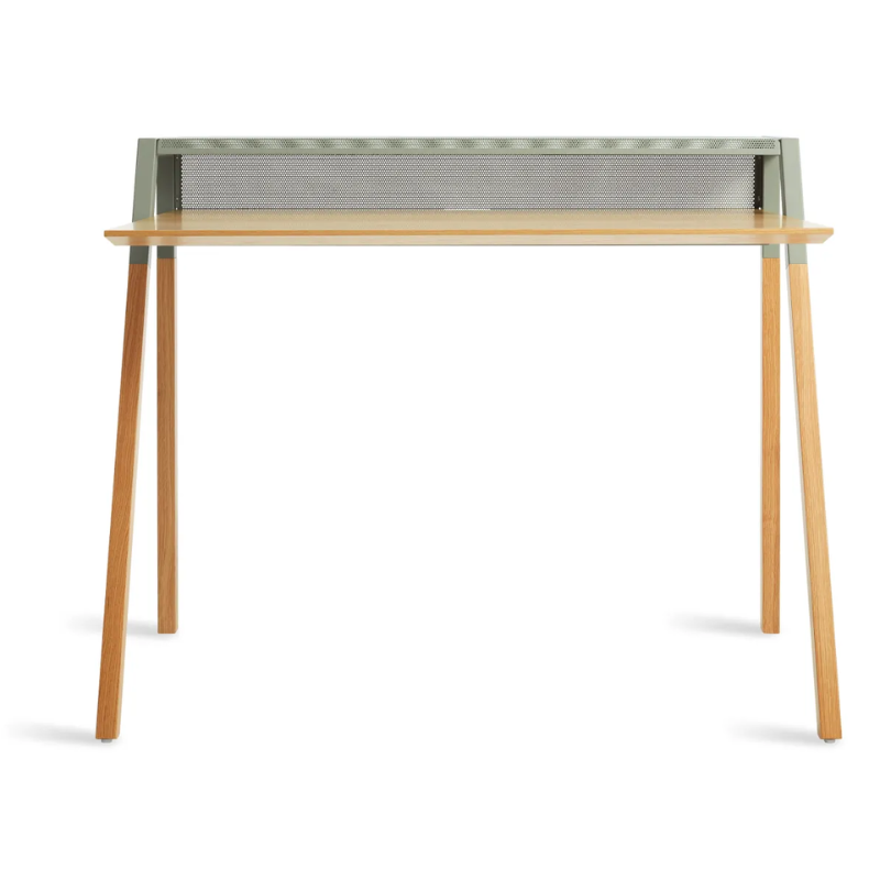 The Cant Desk from Blu Dot with white oak body and grey green back from the front.