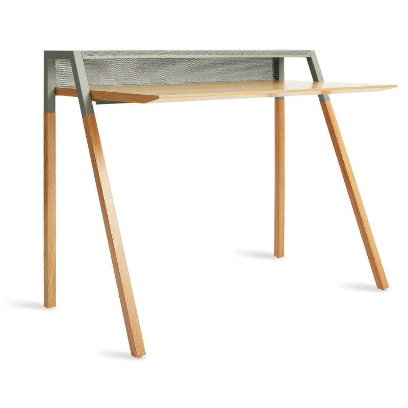 The Cant Desk from Blu Dot with white oak body and grey green back.