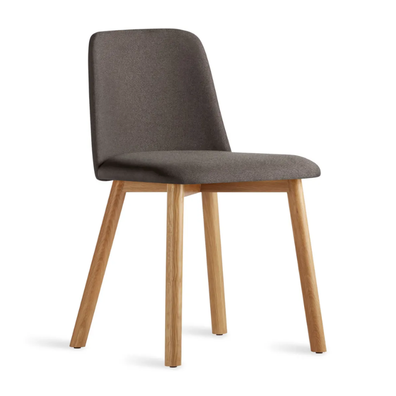 The Chip Chair from Blu Dot with white oak legs and gunmetal upholstery from an angle.
