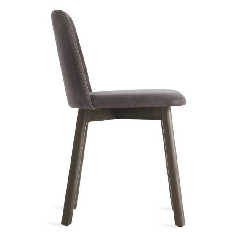 The Chip Chair from Blu Dot with smoke legs and slate leather upholstery from the side.