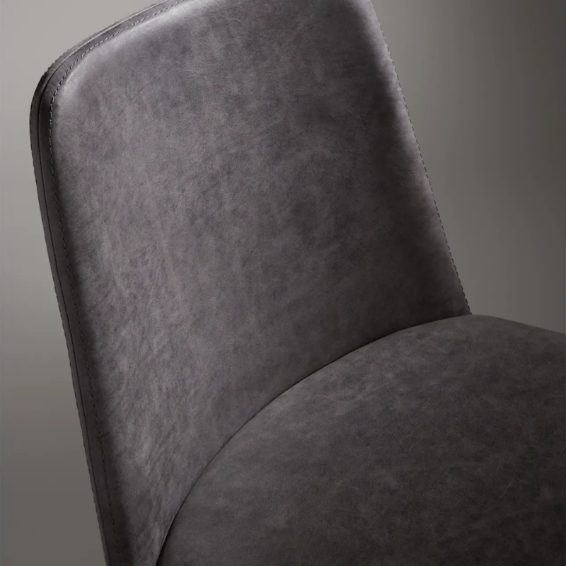 The Chip Chair from Blu Dot slate leather upholstery close up.