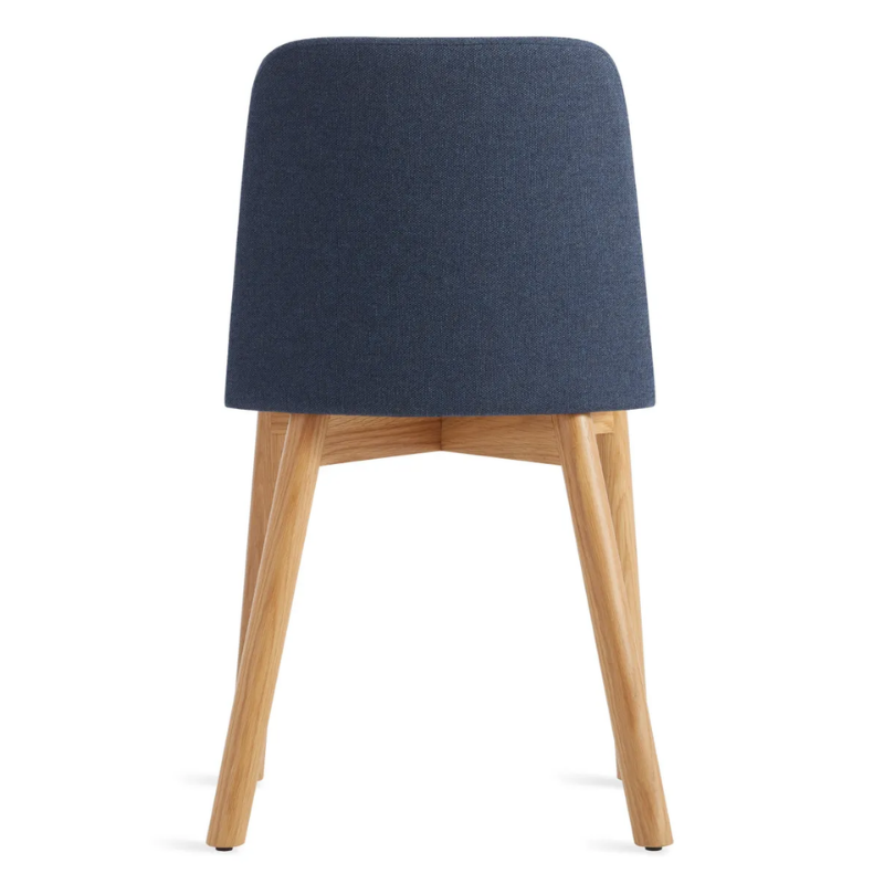 The Chip Chair from Blu Dot with white oak legs and toohey navy upholstery from the back.