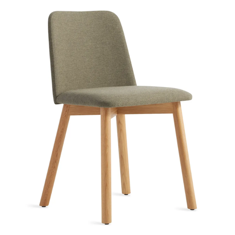 The Chip Chair from Blu Dot with white oak legs and toohey olive upholstery from an angle.