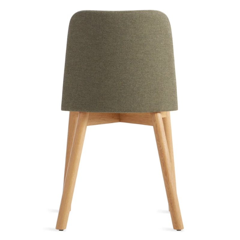 The Chip Chair from Blu Dot with white oak legs and toohey olive upholstery from the back.