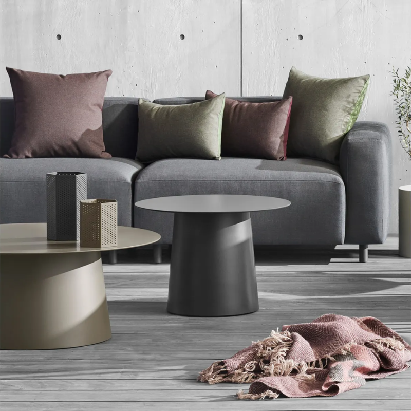 The Circula Low Side Table from Blu Dot in oblivion in a family room.