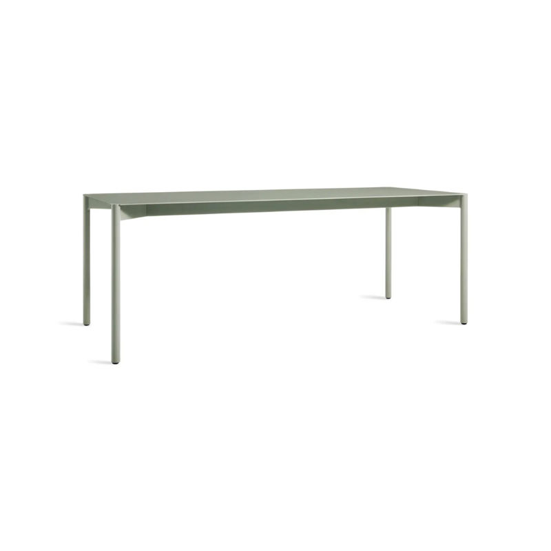 The Comeuppance Dining Table from Blu Dot in grey green from an angle.