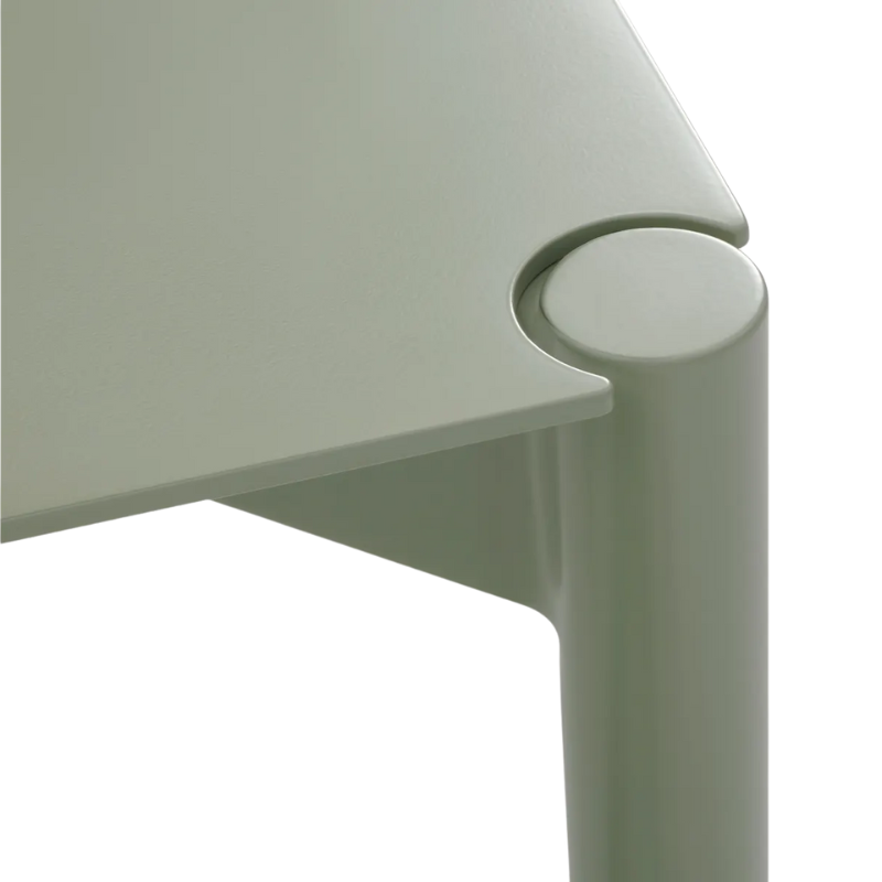 The Comeuppance Dining Table from Blu Dot in grey green corner.
