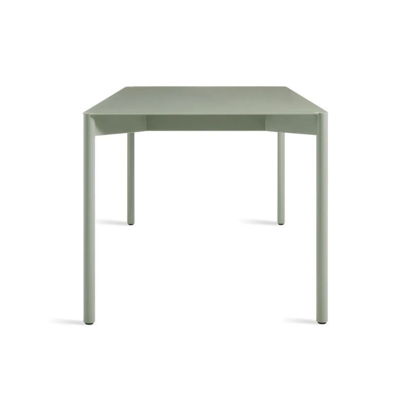 The Comeuppance Dining Table from Blu Dot in grey green from the side.