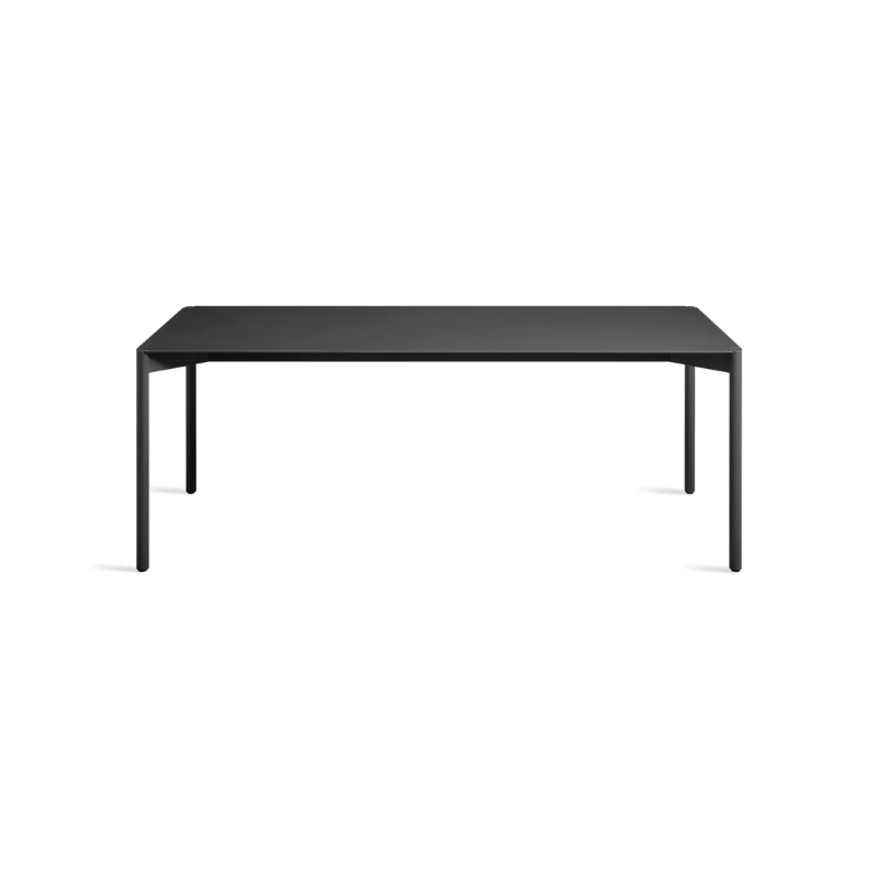 The Comeuppance Dining Table from Blu Dot in oblivion from a high angle.