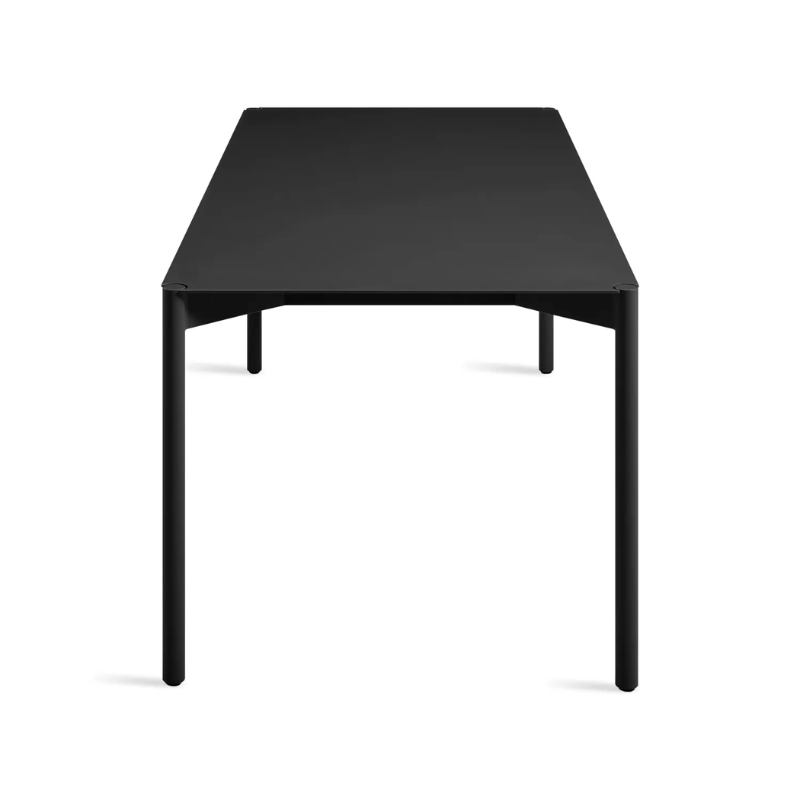 The Comeuppance Dining Table from Blu Dot in oblivion from the side at an angle.