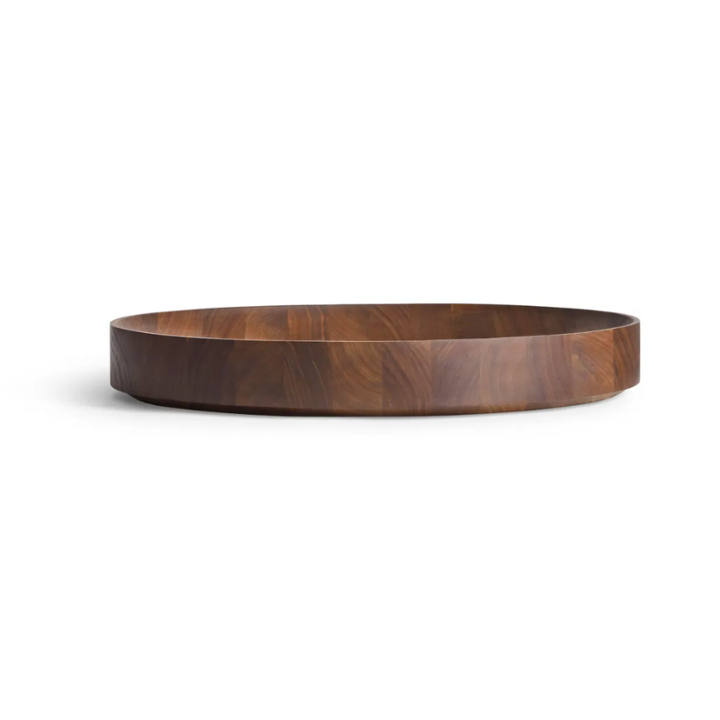 The Cusp Large Bowl from Blu Dot in walnut from an angle.