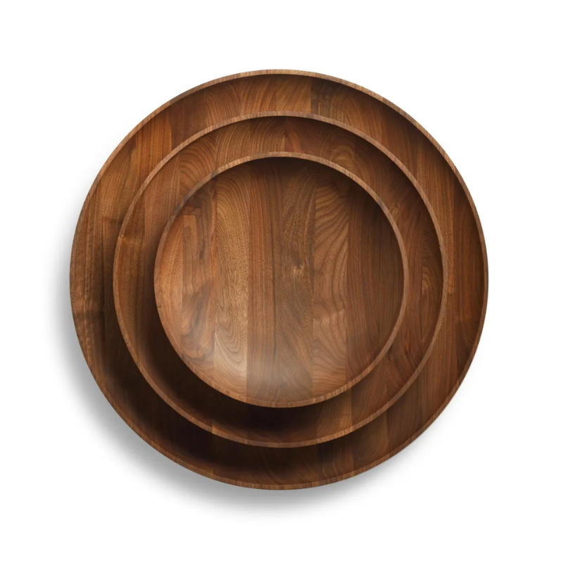 The Cusp Large Bowl from Blu Dot in walnut set of three sizes stacked.