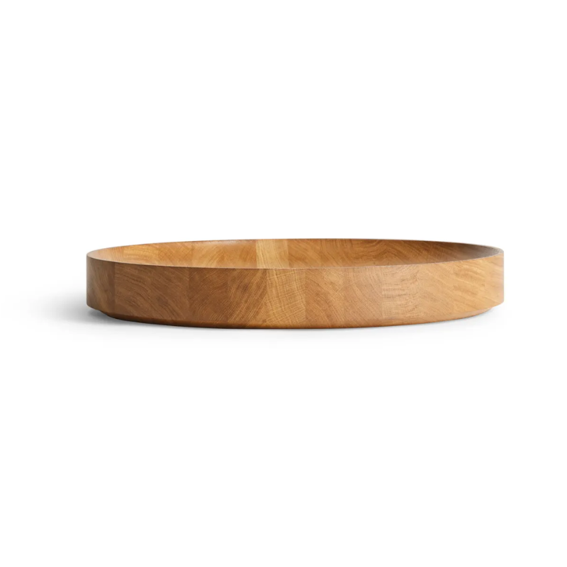 The Cusp Large Bowl from Blu Dot in white oak from an angle.