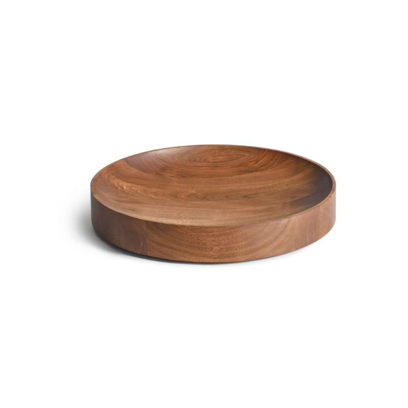 The Cusp Medium Bowl from Blu Dot in walnut from a high angle.