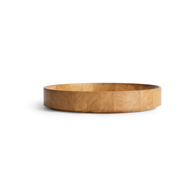 The Cusp Medium Bowl from Blu Dot in white oak from an angle.