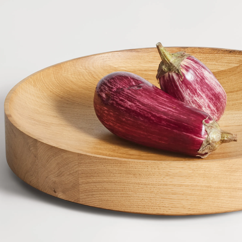 The Cusp Medium Bowl from Blu Dot in white oak in a dining and kitchen setting.