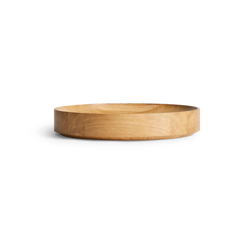 The Cusp Medium Bowl from Blu Dot in white oak from the side.