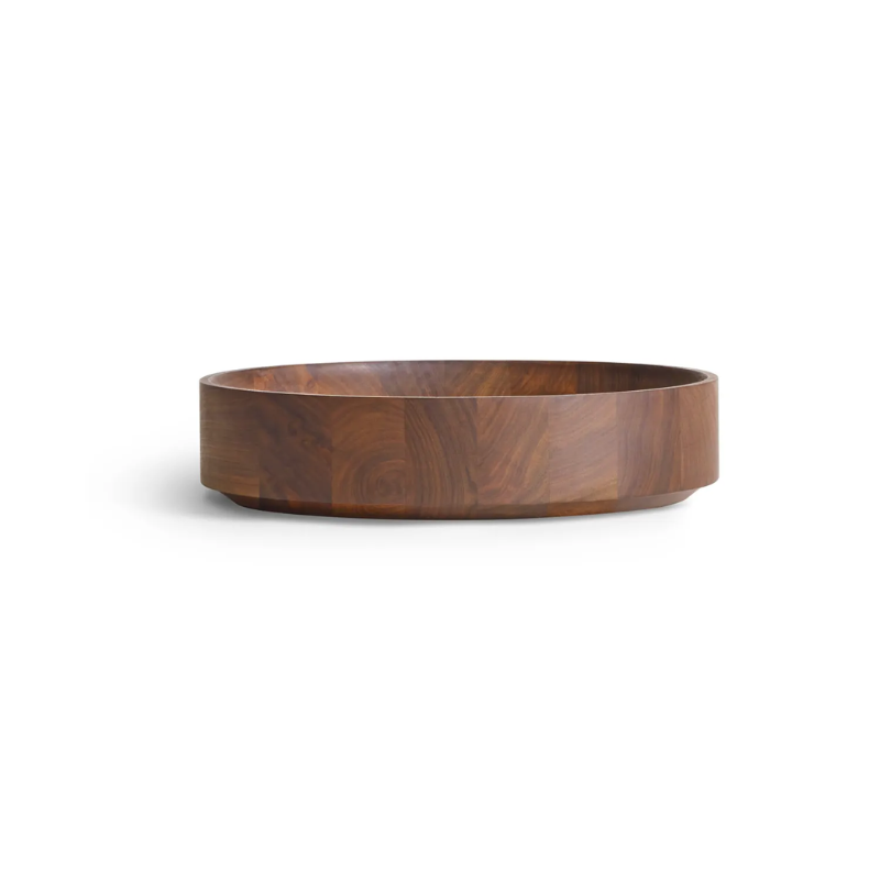 The Cusp Small Bowl from Blu Dot in walnut from the side.