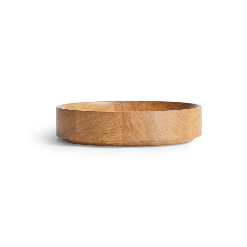 The Cusp Small Bowl from Blu Dot in white oak from an angle.