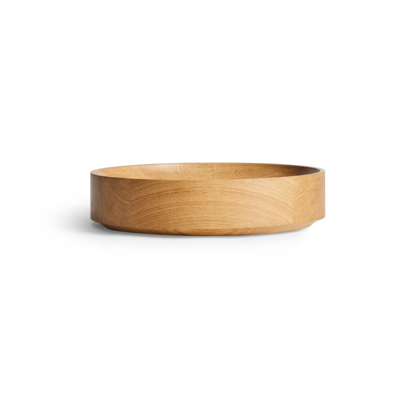 The Cusp Small Bowl from Blu Dot in white oak from the side.