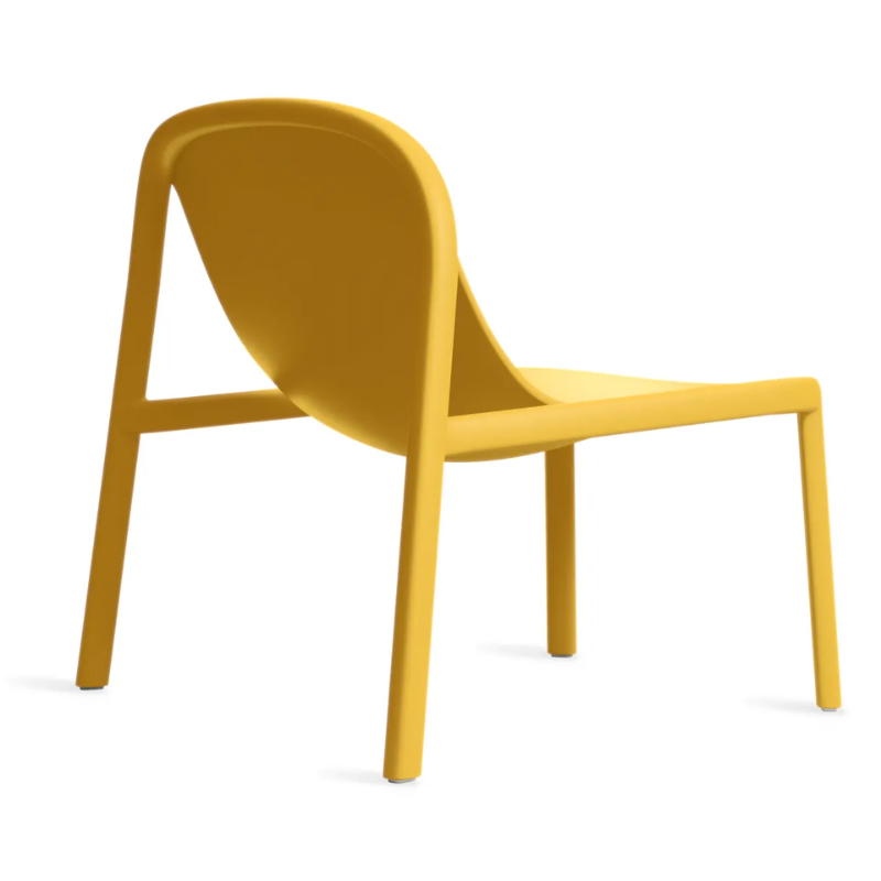 The Decade Lounge Chair from Blu Dot in mustard from the back at an angle.