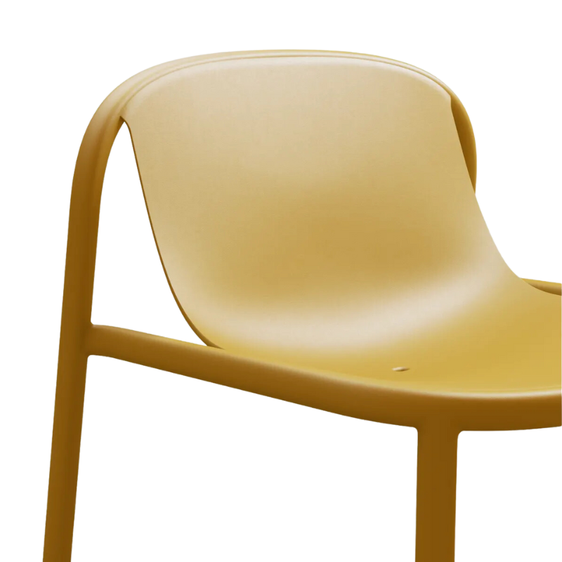 The Decade Lounge Chair from Blu Dot in mustard focusing on the backrest.