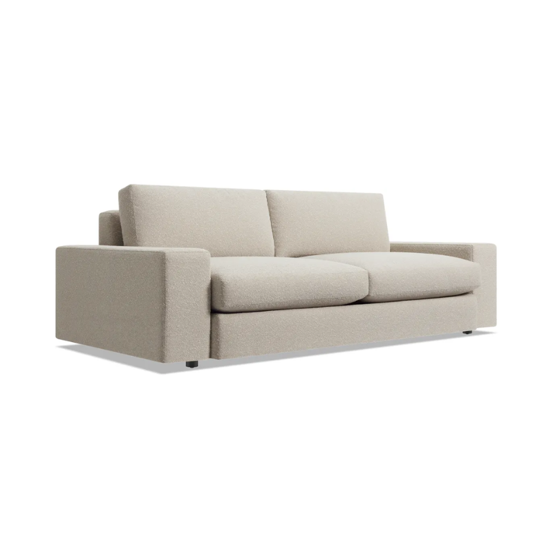 The 82 inch Esker Sofa from Blu Dot in Kelso sand at an angle.