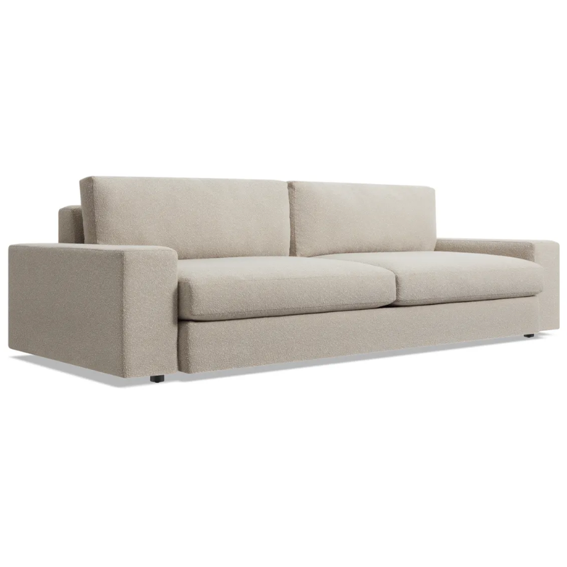 The 98 inch Esker Sofa from Blu Dot in Kelso sand from an angle.