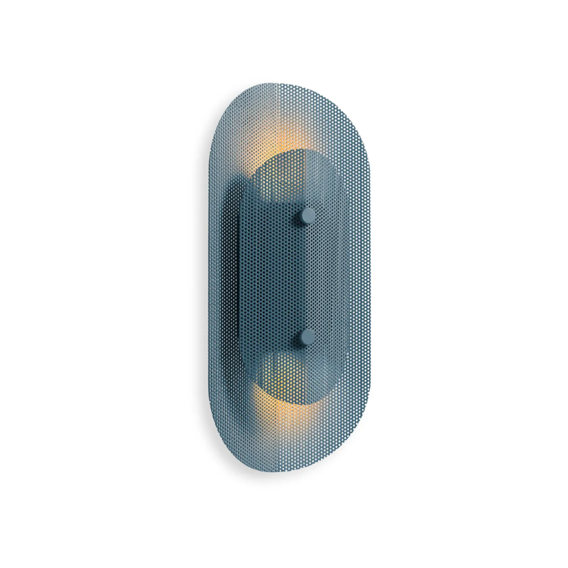 The Filter Sconce from Blu Dot in marine blue from an angle turned on.