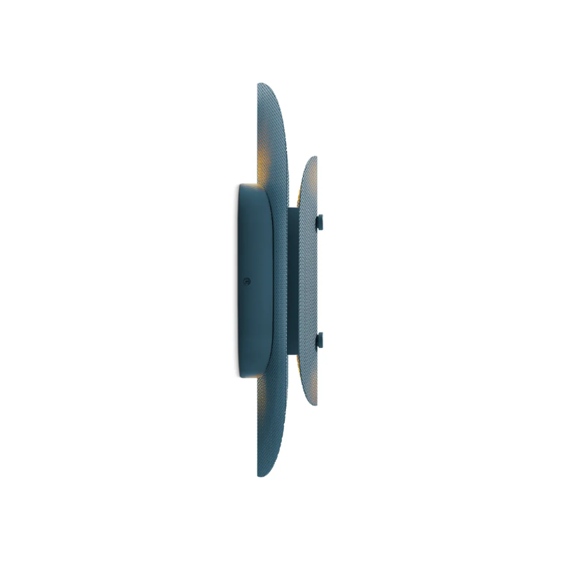The Filter Sconce from Blu Dot in marine blue from the side turned on.