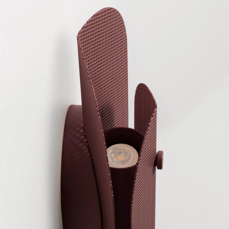 The Filter Sconce from Blu Dot in oxblood close up.