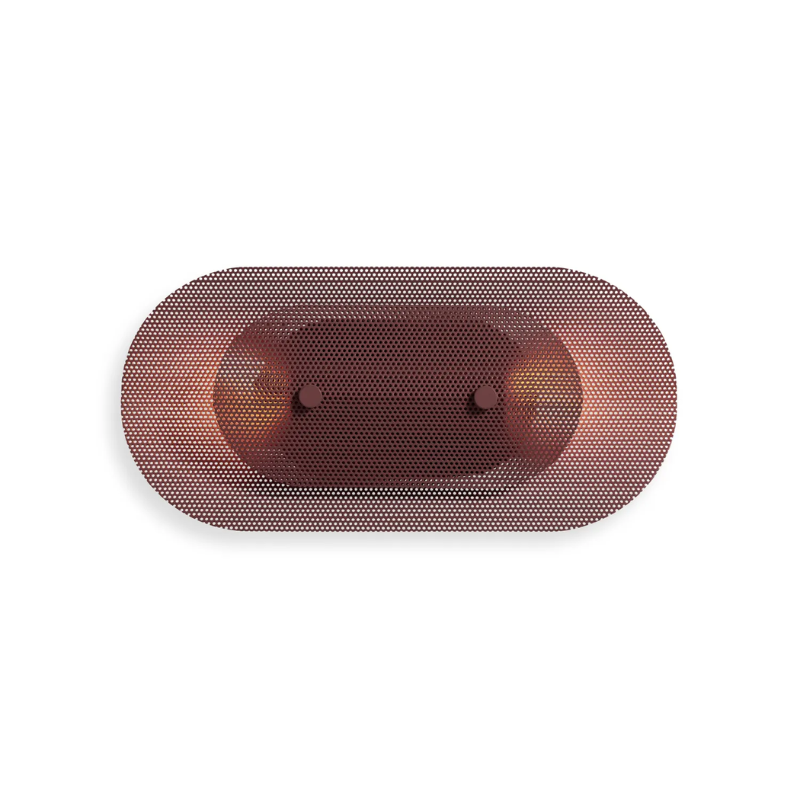 The Filter Sconce from Blu Dot in oxblood horizontal turned on.