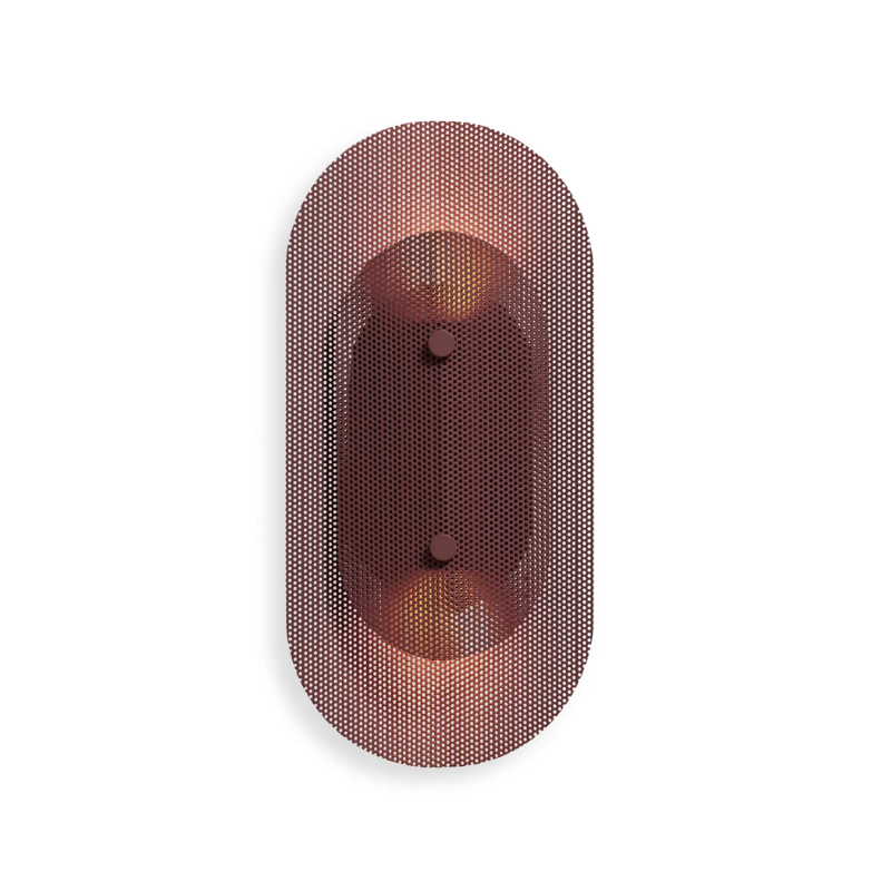The Filter Sconce from Blu Dot in oxblood turned on.