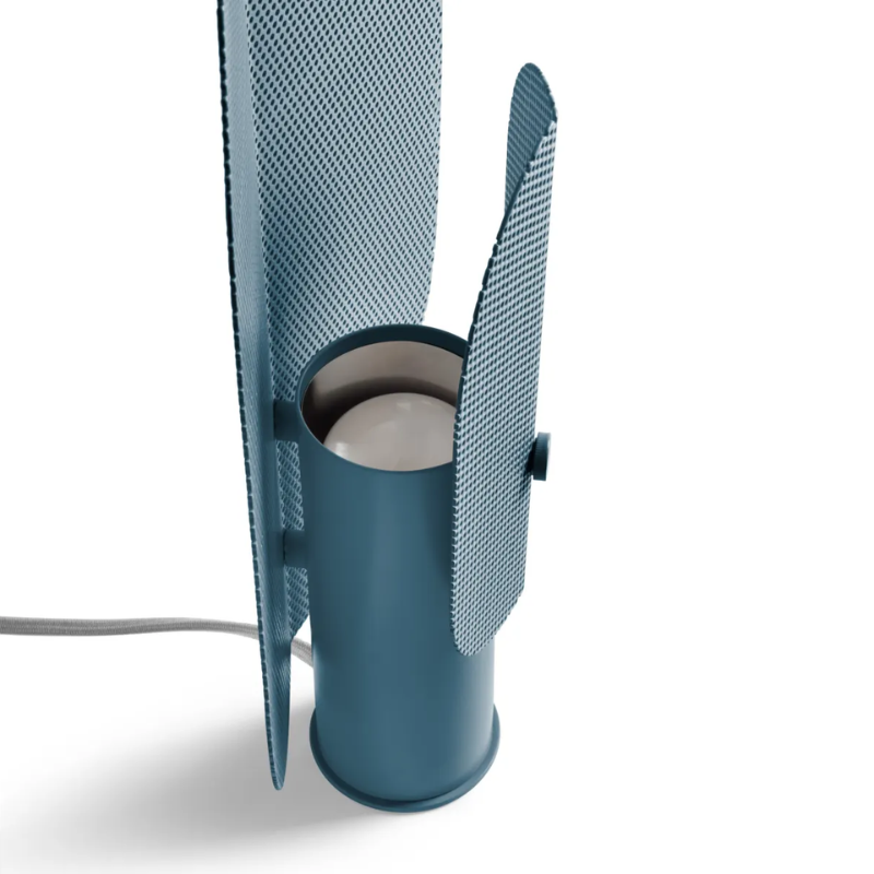 The Filter Table Lamp from Blu Dot in marine blue focusing on the light bulb turned off.