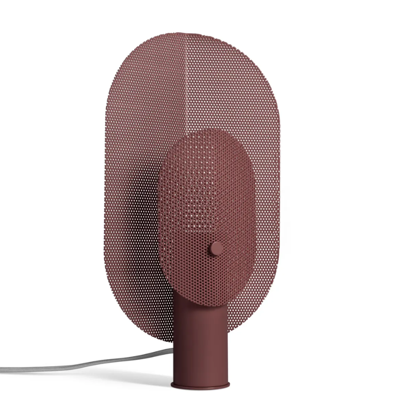 The Filter Table Lamp from Blu Dot in oxblood from an angle.