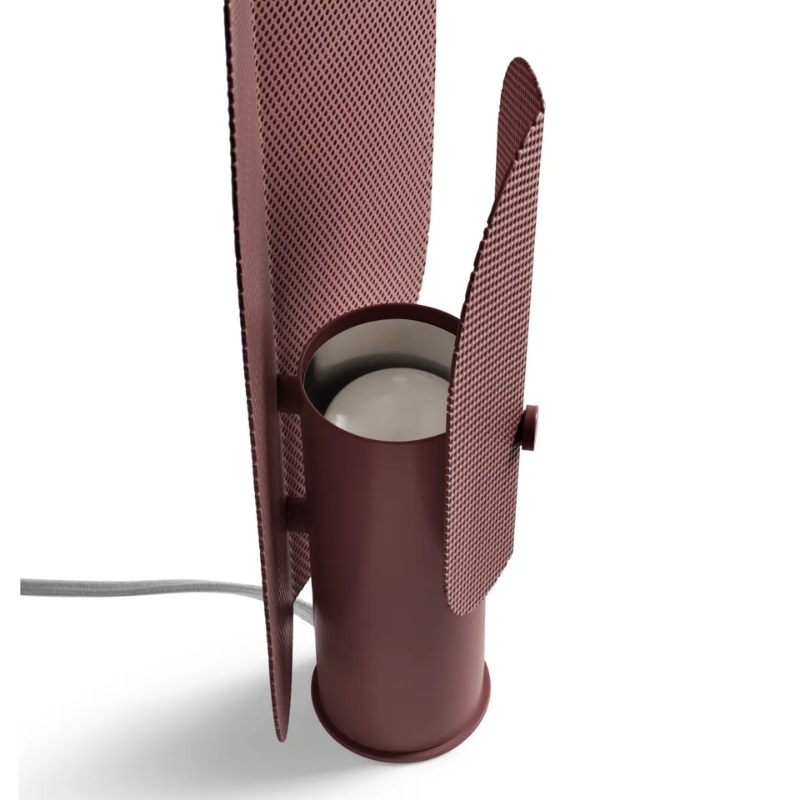 The Filter Table Lamp from Blu Dot in oxblood focusing on the light bulb turned off.