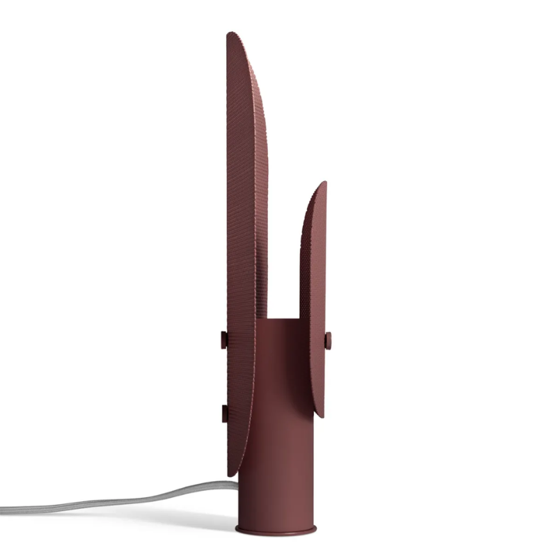 The Filter Table Lamp from Blu Dot in oxblood from the side.