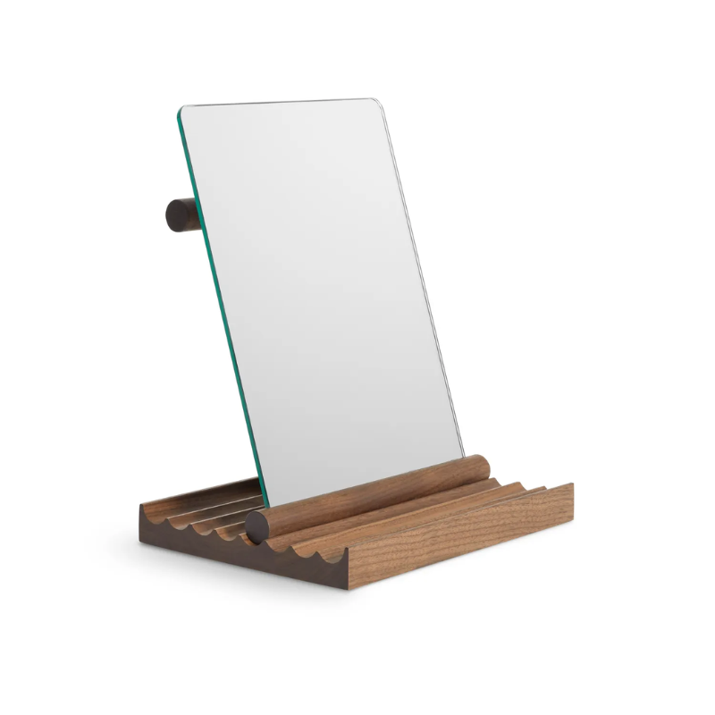 The Furrow Table Mirror from Blu Dot in walnut from an angle.