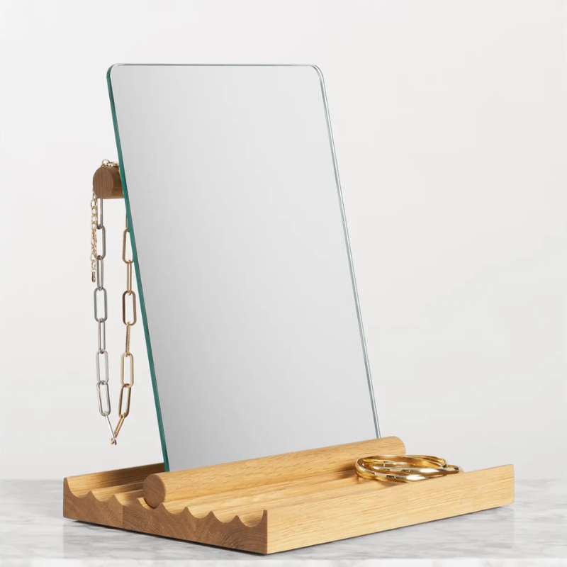 The Furrow Table Mirror from Blu Dot in white oak in a living room studio.