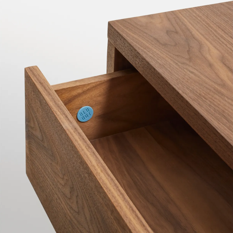 The Go Forth Bench from Blu Dot in walnut with the drawer open close up.