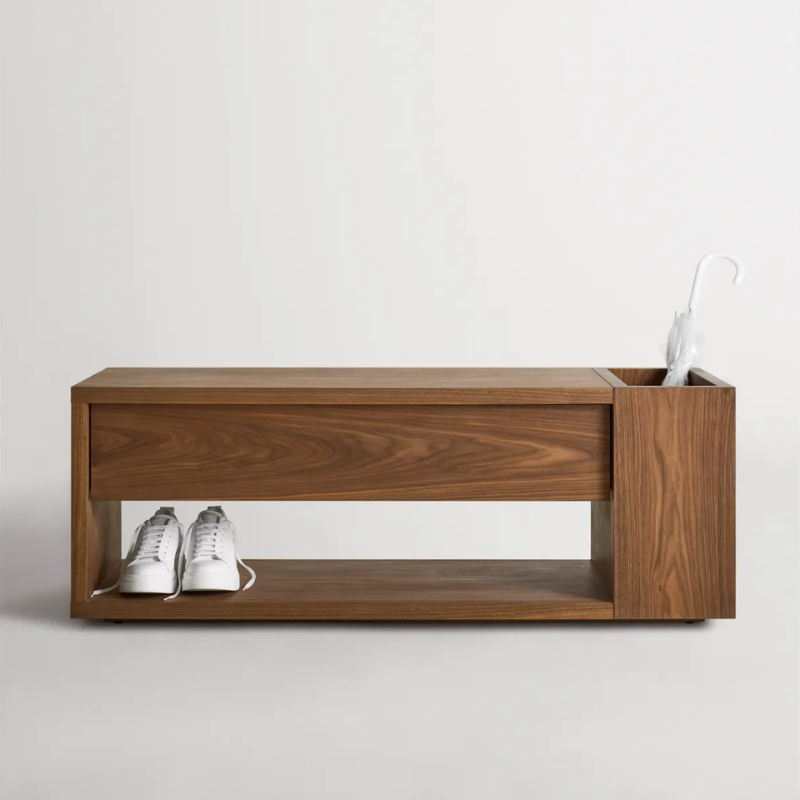 The Go Forth Bench from Blu Dot in walnut in a family room.
