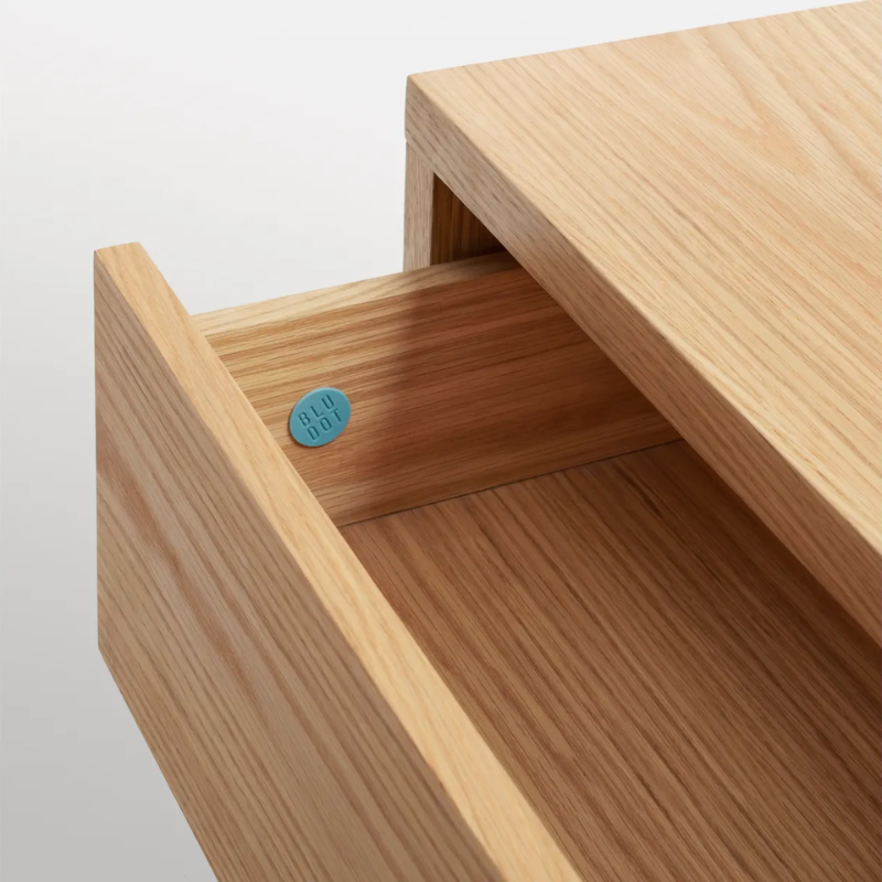 The Go Forth Bench from Blu Dot in white oak with the drawer open close up.