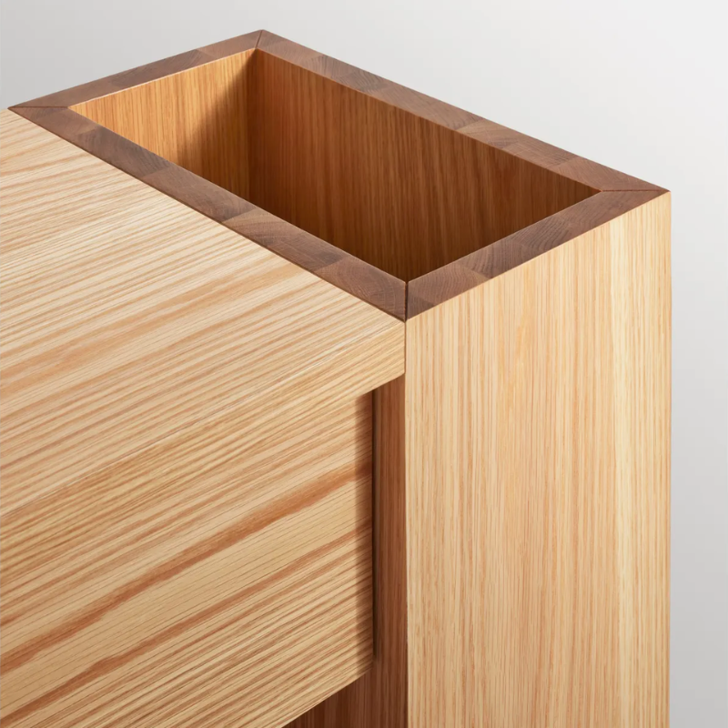 The Go Forth Bench from Blu Dot in white oak focusing on the storage in detail.