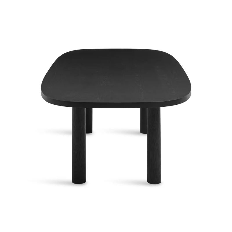 The 100 inch Good Times Dining Table from Blu Dot in black on ash from the side at an angle.