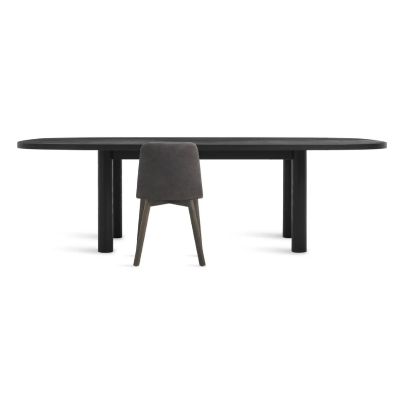 The 100 inch Good Times Dining Table from Blu Dot in black on ash in a studio.